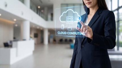 Businesswoman interacting with cloud computing interface in modern office