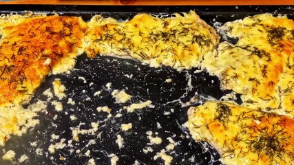 Tasty cheese toast with herbs cooking on a hot griddle, delicious aroma