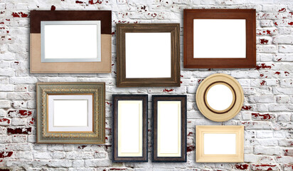 Horizontal banner with blank picture frames hanging on brick wall. Empty photo frame set on wall background. Mock up poster frame template for decor room. Retro Interior design. Copy space for text