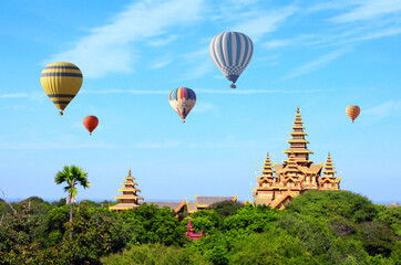 Balloon flight, famous tourist attraction of Bagan, Myanmar. Air balloons and temples in the Archaeological Zone, Bagan, Burma. Topic of vacation, travel, trip abroad on vacation, cruises and tours