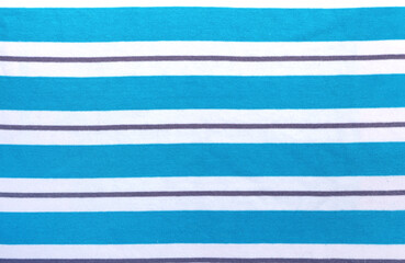 Blue and white style striped fabric texture. Background with  striped closeup weave fabric. Pinstripe material of light azure and white color