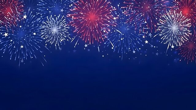 A vibrant display of red white and blue fireworks illuminates a dark celebratory night sky