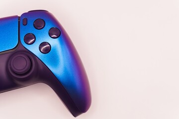 A gamepad for consoles on a white background, gaming addiction, gaming ban for teenagers, gaming controls for parents, for banners and advertising. High quality © Karen Vardanian