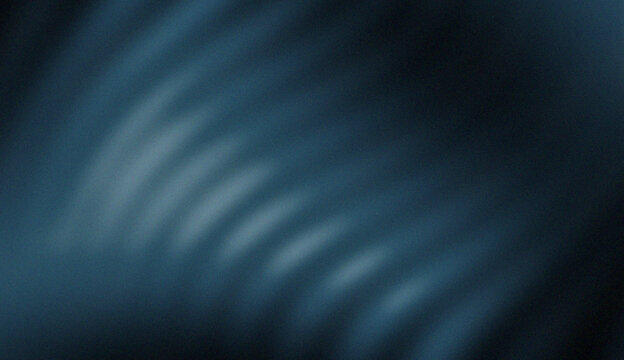 Abstract deep navy blue wavy light beams on dark background. Modern blurred motion texture with soft rhythmic curves, sleek atmospheric glow, and elegant cinematic digital backdrop.