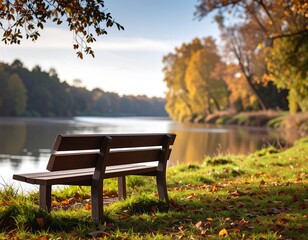 Scenic image of an empty wooden bench overlooking a calm river on an autumn day with colorful foliage
