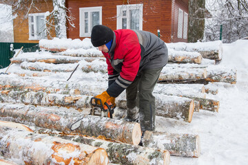 Russia. The life of ordinary people. A man, 50 years old, gathers firewood to heat his house and sauna.