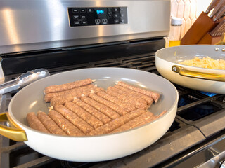Breakfast Sausages Cooking in Skillet on Stove