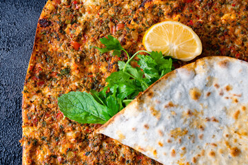 Big size  lahmacun on black stone background