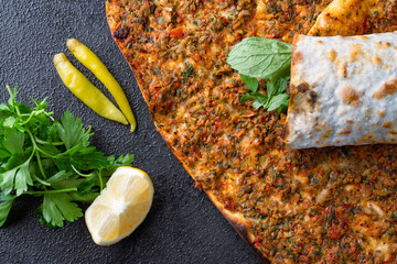 Big size  lahmacun on black stone background