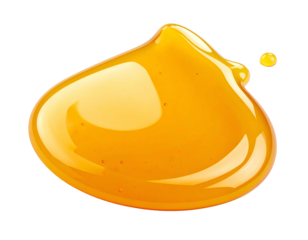 Close-up of golden, viscous fluid blob against black background