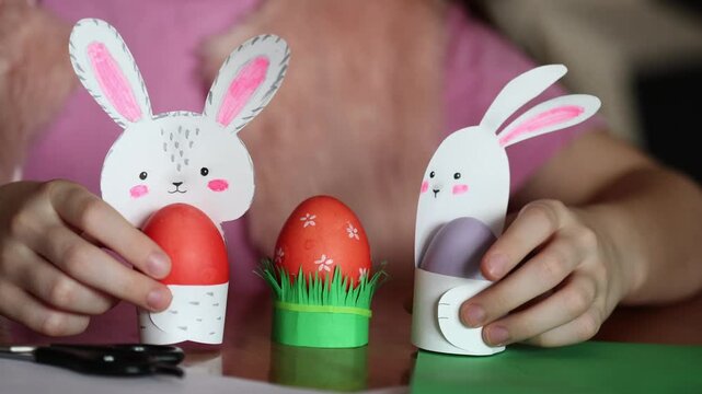 Children's craft: Easter egg stands in shape of rabbits and grass. kids odd job diy Easter bunny