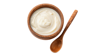  Creamy yogurt in wooden bowl with spoon placed beside bowl isolated on transparent background