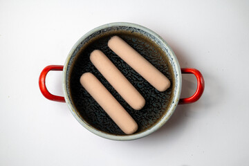 Hot Dog Sausages Boiling in Pot