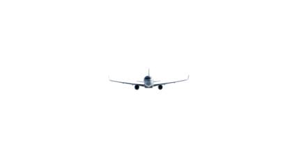 Small white private jet airplane flying directly towards viewer on clear sky