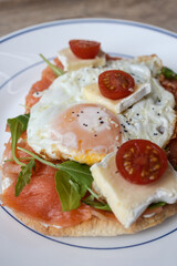 Smoked salmon toast with fried eggs and brie
