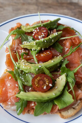 Smoked salmon avocado toast with cherry tomatoes