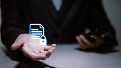 Businessman holding virtual document icon with lock for data privacy and cybersecurity.