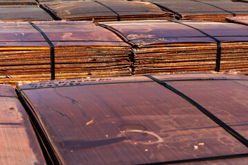 Stacks of copper cathodes await delivery