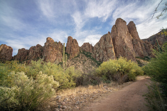 Dirt trail in vibrant mountainous desert landscape