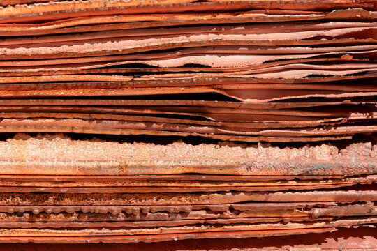Stacks of shiny copper cathodes