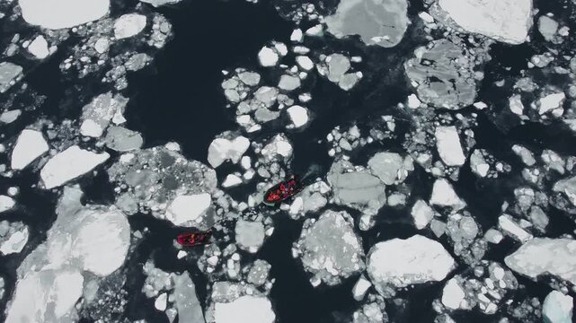 Two Small Boats Navigating Through Ice and Icebergs Near Perez Cape
