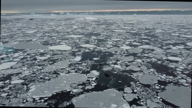 Two Small Boats Navigating Through Ice and Icebergs Near Perez Cape
