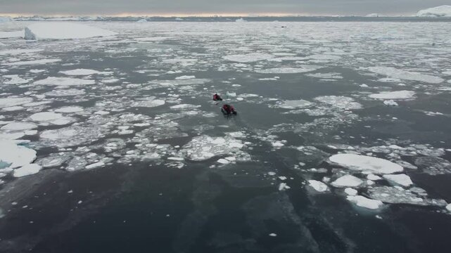 Two Small Boats Navigating Through Ice and Icebergs Near Perez Cape