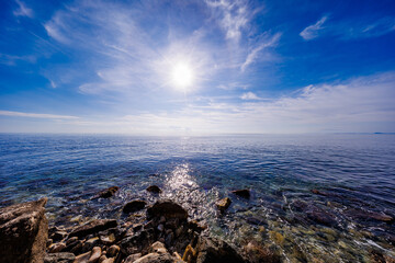 High Contrast Coastal Rocks and Sun Glare