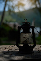 Vintage lantern in rustic natural setting