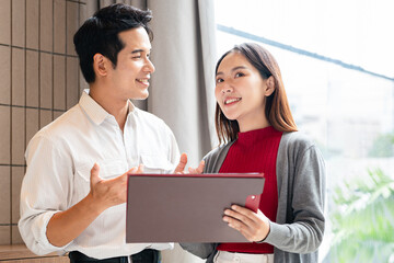 Two engaged business professionals  brainstorming on  project with document papers, speaking, discussing creative ideas, plan, strategy, task, chatting at work desk in office.
