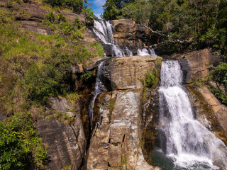 Aerial View of Upper Diyaluma Waterfall Cascades Flowing Down a Steep Rock Face, Sri Lanka