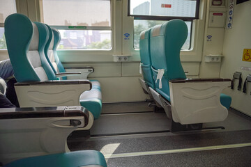 Modern Train Interior with Comfortable Teal Seats