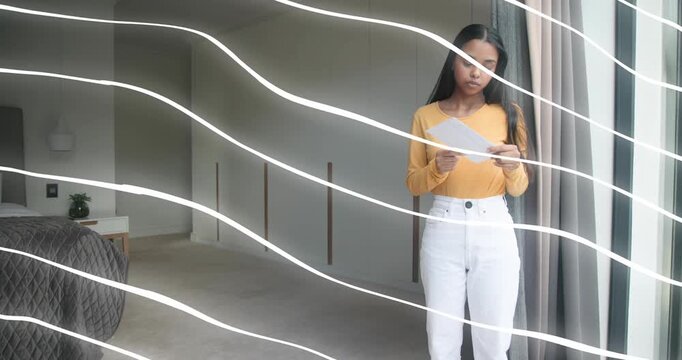 Woman walking from left holding papers, pausing, reviewing as wavy overlay marking pages for office