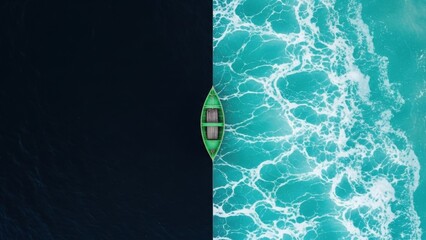 Green boat sails through contrasting ocean waters