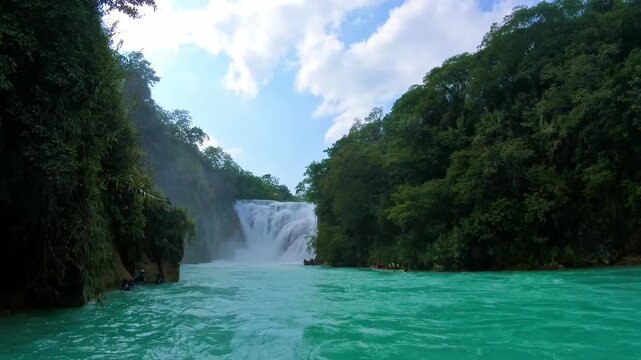 Discover El Meco Waterfall in El Naranjo San Luis Potosi Mexico in a tropical setting with clear blue water