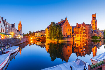 Fototapeta premium Bruges, Belgium. The Rozenhoedkaai canal in Bruges with the Belfry in the background.