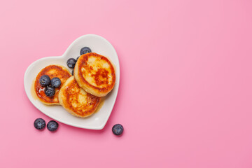 Homemade pancakes with blueberries and syrup