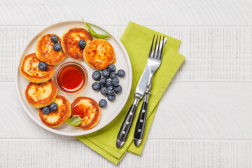 Homemade pancakes with blueberries and syrup