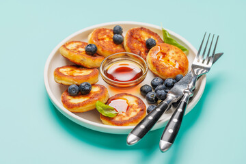 Homemade pancakes with blueberries and syrup