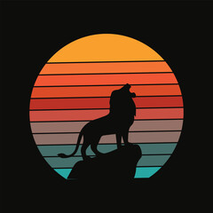 Roaring lion silhouette on a rock at sunset vector © Click Studio