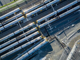 Aerial view of commuter trains parked at a train yard in Auckland, New Zealand. The trains are awaiting their next scheduled run. © Stefan