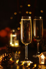 Two glasses with champagne in New Year Eve and Christmas style	