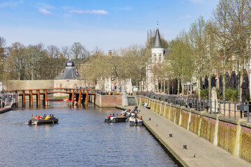 Motorboats in the canal of the historic center in Breda, Netherlands