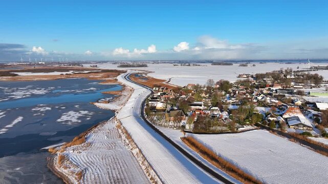 Winter village beside a frozen lake