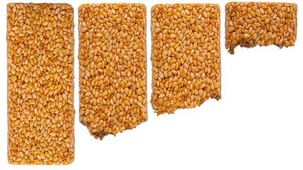 Isolated set of bitten sesame kozinaki on a white background