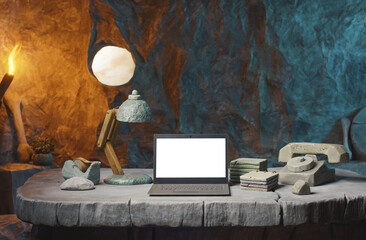 High-performance laptop on a prehistoric office desk