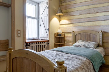 Cozy rustic bedroom corner with wooden bed and warm lighting