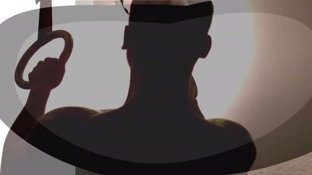 A man is seen slowly chalking his hands in a gym