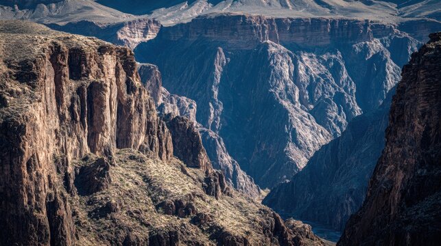 Majestic Craggy Canyon Walls with Visible Layers of Sedimentary Rock Under Sunlight