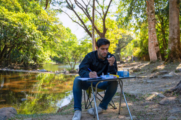 The environmentalist is testing a water Stream in the forest.